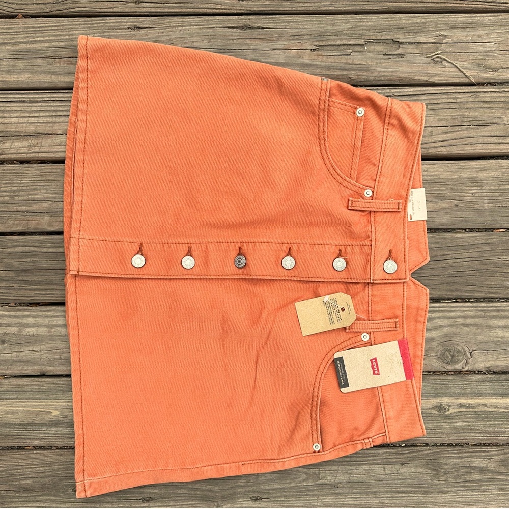 Brand new Levi’s Jean skirt. Salmon-y color. Size 31